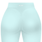 Short gainant femme FL-FIT turquoise vue de dos, taille haute, compression moyenne, ceinture large, finitions plates anti-frottement, logo FL-FIT orange brodé au bas du dos centré, fond blanc