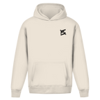 Sweat à capuche beige oversize vu de face, design épuré et ample avec un petit logo noir contrastant sur la poitrine.