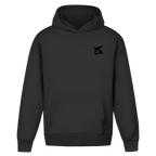 Sweat à capuche noir oversize vu de face, design épuré et ample avec un petit logo noir contrastant sur la poitrine.
