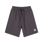 Short lifestyle gris anthracite FL-FIT, coupe classique polyvalente pour le quotidien et le fitness, avec logo blanc et cordon de serrage.