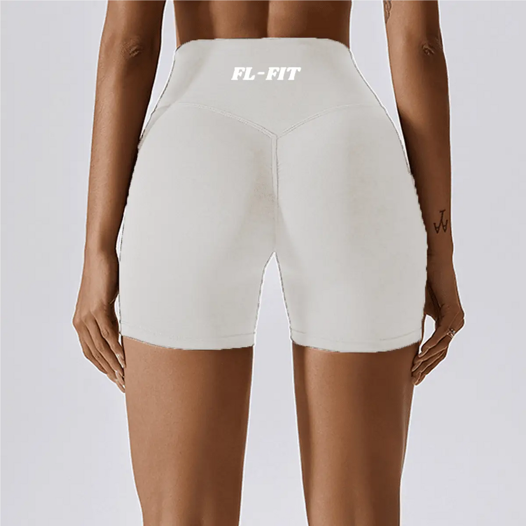 Femme portant un short Legging gainant blanc FL-FIT pour femme fitness
